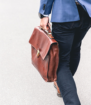 a person carries a briefcase